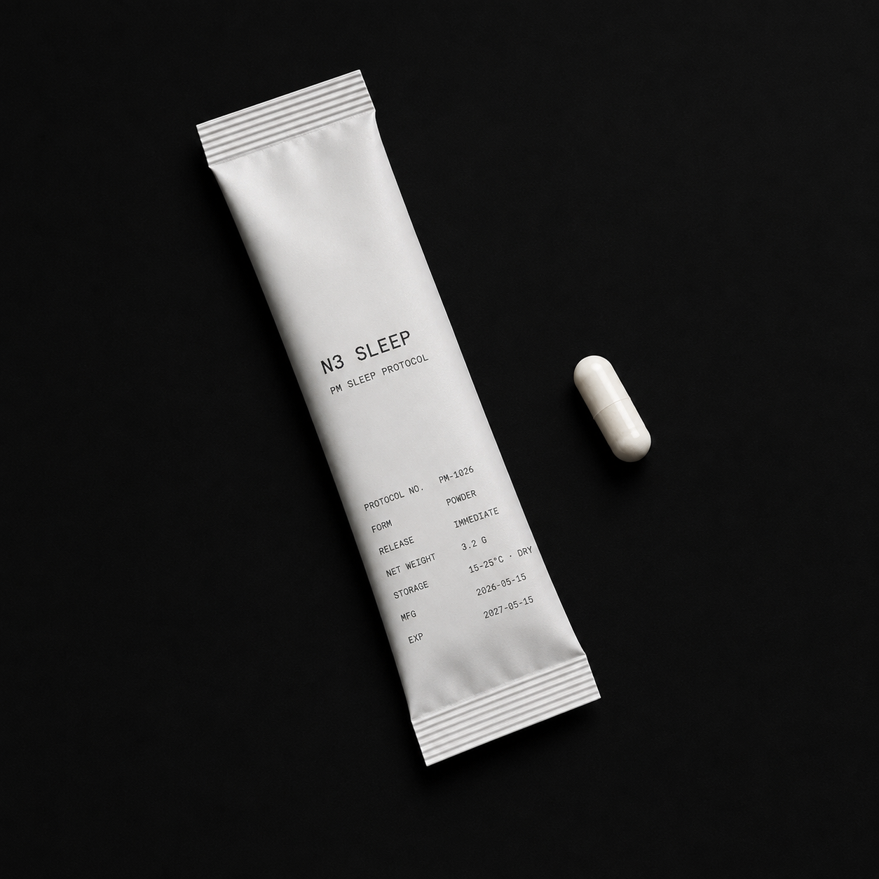 An Arève Sciences sachet and two capsules on a dark ground, the printed label legible